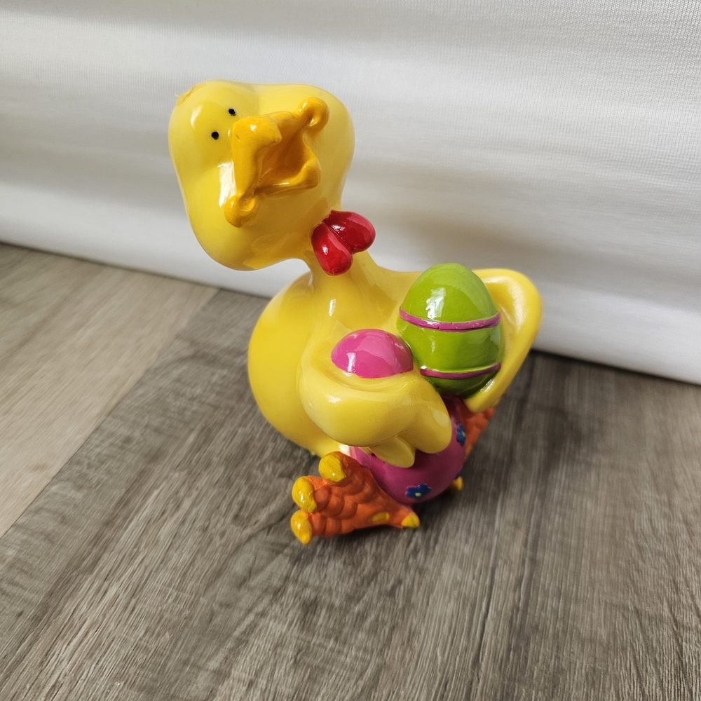 Ceramic Yellow Duck Figurine with Colorful Eggs